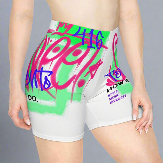 Retro white and neon biker shorts with Toronto and 416 text and graffiti graphics in front of a gray background | Ohhh So Swag