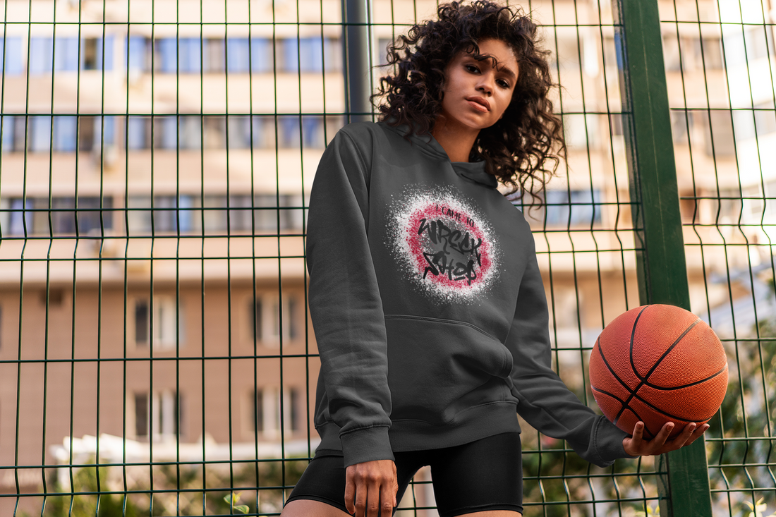 young-athletic-woman-outside-wearing-Ohhh-So-Swag-I-Came-to-Wreck-Shop-sweatshirt-while-holding-basketball-in-one-hand