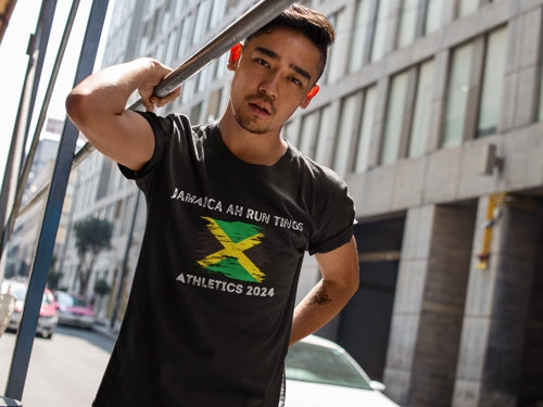 handsome-man-wearing-black-jamaica-ah-run-tings-athletics-2024-tshirt-on-street