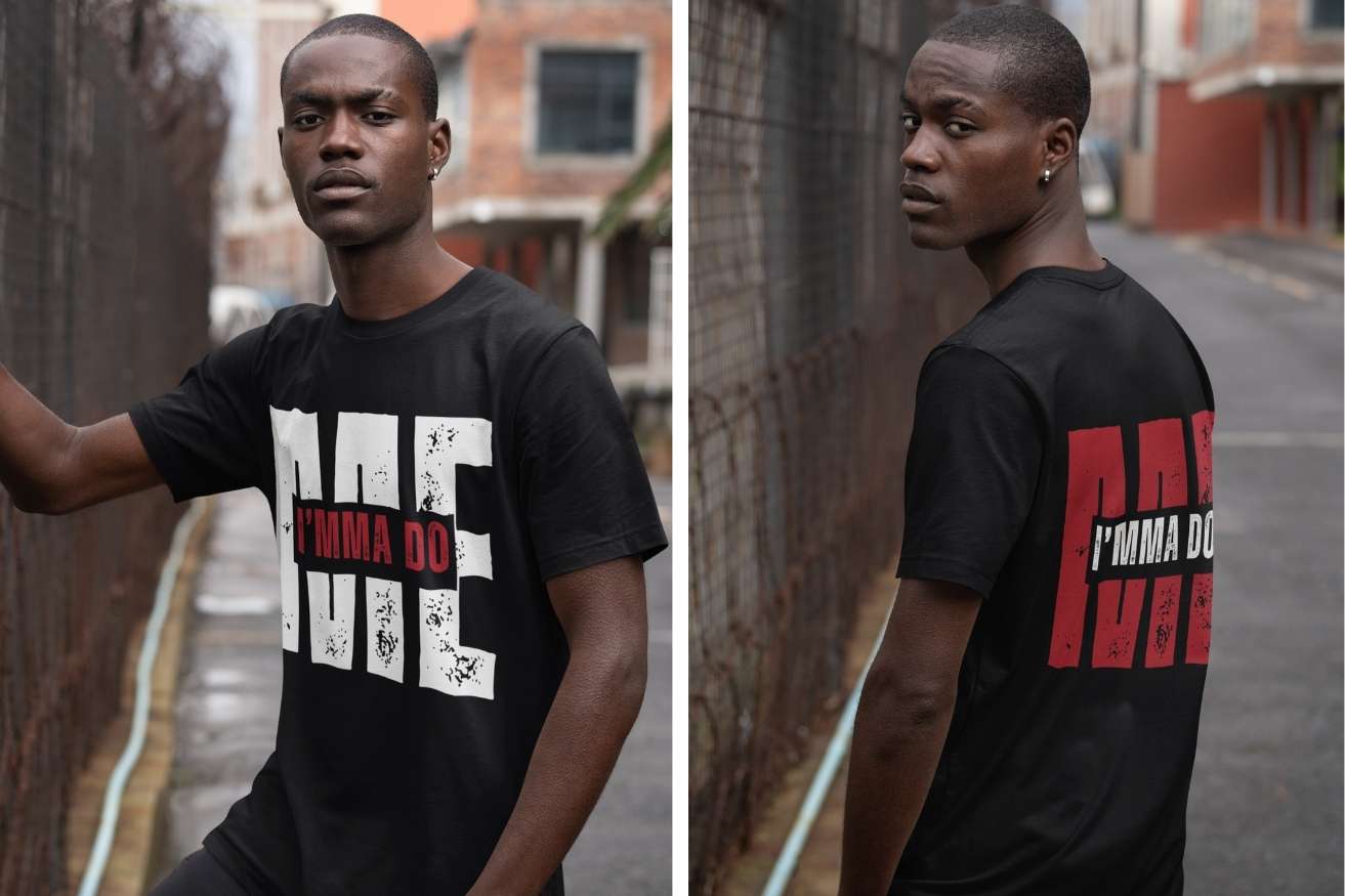 Man wearing an Ohhh So Swag black t-shirt with I'mma Do Me text, standing by a wall outdoors.