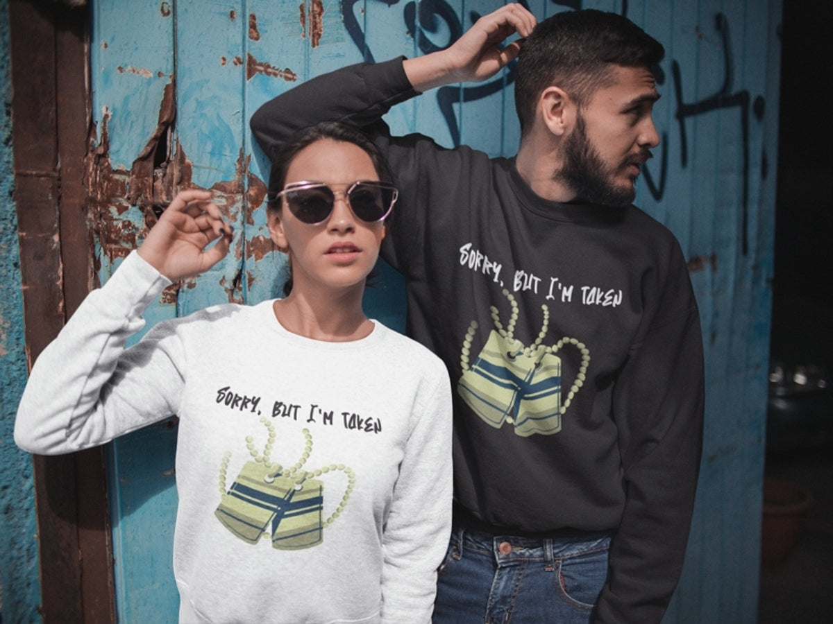 couple-wearing-SORRY-BUT-I_M-TAKEN-crewneck-sweatshirts-standing-against-door-ohhh-so-swag