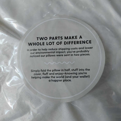 Pillow packaging with explanation of delivery of throw pillow in two separate parts